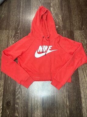 Woman’s orange Nike cropped hooded sweatshirt size small